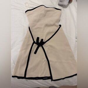 Meshki cream and black asymmetrical dress.